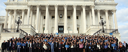 Hundreds of students standing in front of a building in Washington